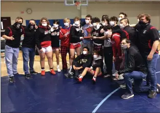  ?? BRIAN RIPPEY — READING EAGLE ?? The Wilson wrestling team gets together after beating Daniel Boone to win the Berks championsh­ip.