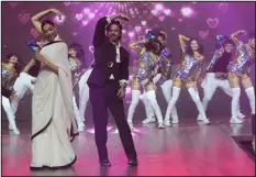  ?? RAJANISH KAKADE — ASSOCIATED PRESS FILE ?? Bollywood actors Deepika Padukone, left, and Shah Rukh Khan dance at an event to celebrate the success of their movie “Jawan” in Mumbai, India, on Sep. 15.