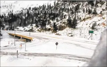  ?? CALTRANS VIA AP ?? This image from video provided by Caltrans shows a closed westbound Interstate 80 on Sunday. The road from Colfax to the Nevada state line was shut down due to heavy snowfall.