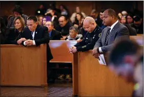  ?? (File Photo/AP/Pool/The Dallas Morning News/Tom Fox) ?? Dallas Mayor Eric Johnson (right) and Dallas Police Chief Eddie Garcia kneel in prayer Oct. 19, 2022, during the funeral mass for Dallas Police Officer Jacob Arellano at St. Paul Catholic Church in Richardson, Texas. Arellano was killed on his way to work in a wrong-way crash involving a drunken driver.