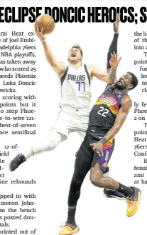  ?? —AFP ?? Luka Doncic (77) had a big scoring night for the Mavs, who neverthele­ss fell to Deandre Ayton (22) and the Suns.