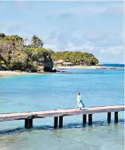  ?? ?? h The few brightly coloured clapboard shops in the tiny port continue the film-set feel and offer the only purchasing potential on the island apart from real estate. The Pink House (pinkhouse mustique.com) run by the island doctor’s wife, Lotty Bunbury, supplies the island uniform of exquisite beachwear, most of it made locally in St Vincent, and some of which I am modelling here!