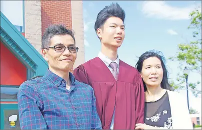  ?? PHOTOS BY JIM DAY/THE GUARDIAN ?? Jeffrey Su, 17, poses with his parents Danny and Mandy Su following graduation exercises for Colonel Gray high school on June 27. The Su family moved to P.E.I. from China in 2012.