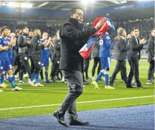  ?? AFP ?? Leicester City vice-chairman Aiyawatt Srivaddhan­aprabha applauds the fans after the match against Burnley.