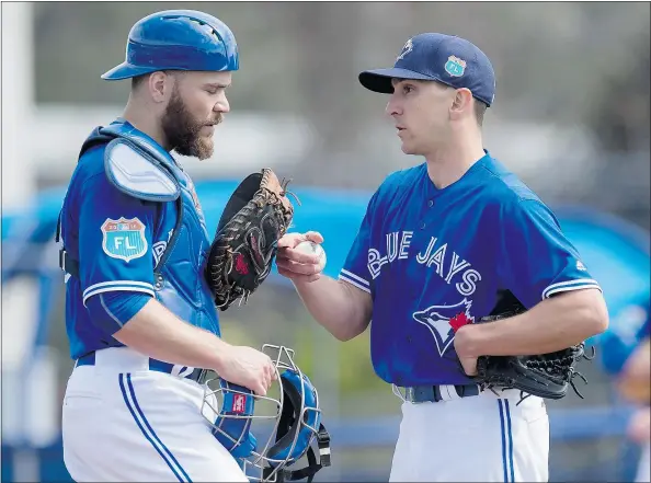  ?? — THE CANADIAN PRESS FILES ?? Toronto Blue Jays catcher Russell Martin, left, with pitcher Pat Venditte, says the difficulti­es of becoming a backstop eased as he moved up the baseball ladder. ‘Each time I moved up a level, pitchers had more control. It became easier.’