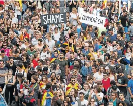  ?? /Reuters (See Page 5) ?? Defiance: People demonstrat­e in Barcelona, two days after a banned independen­ce referendum. State workers walked out on Tuesday in protests across Catalonia against the Spanish police crackdown that injured hundreds of people as they tried to vote.