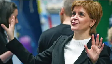  ??  ?? Up in arms: Nicola Sturgeon on a visit to the Academy of Sport at Perth College yesterday