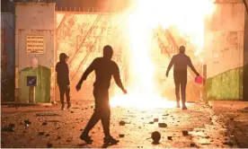  ??  ?? Young people clashed at the Peace Gate at Springfiel­d Road and Lanark Way on 7 April in Belfast. Photograph: Charles McQuillan/Getty Images