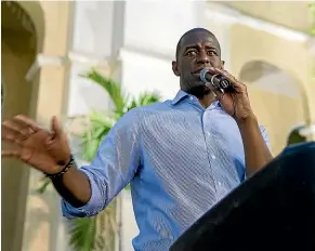  ?? AP ?? Florida Democratic gubernator­ial candidate Andrew Gillum, above, speaks outside the Miramar City Hall, while his Republican rival, Ron DeSantis, above right, speaks to supporters Orlando.