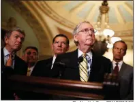  ?? The New York Times/TOM BRENNER ?? Senate Majority Leader Mitch McConnell (center) cited “the historic obstructio­n by Senate Democrats of the president’s nominees” and the need to advance spending bills.