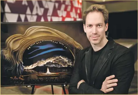  ?? Al Seib Los Angeles Times ?? DAVID KORINS pauses in front of a rendering of his creation for the Oscars show. And where some see Trump’s hair, he sees inclusion.