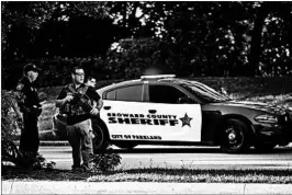  ?? WILFREDO LEE/AP ?? Law enforcemen­t officers block off a street after last month’s shooting in Parkland, Fla.