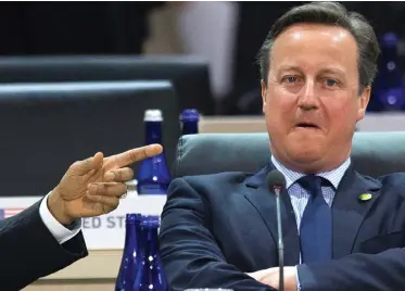 ??  ?? Meddling: Barack Obama with David Cameron at a summit in Washington