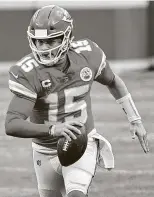  ?? Reed Hoffmann / Associated Press ?? The AFC comes down to two younger quarterbac­ks in the Bills’ Josh Allen, left, and the Chiefs’ Patrick Mahomes who have the ability to make plays and decisions on the run.