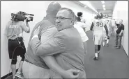  ?? Democrat-Gazette file photo ?? Arkansas Athletic Director Jeff Long congratula­tes a member of the UA football staff after the Razorbacks’ victory over TCU at Fort Worth in 2016. Long was fired Wednesday.