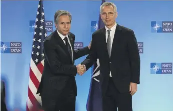  ?? VIRGINIA MAYO/AP ?? U.S. Secretary of State Antony J. Blinken (left) shakes hands with NATO Secretary General Jens Stoltenber­g at NATO headquarte­rs in Brussels on Wednesday.