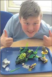  ??  ?? School pupils with some of the Lego creations