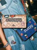  ??  ?? Snow White and The Seven Dwarfs foldover crossbody clutches