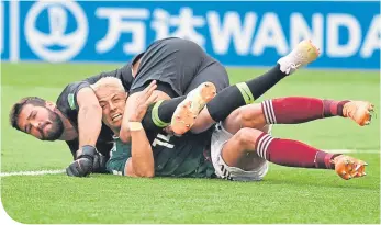  ??  ?? Alisson gets tangled up with Javier Hernandez of Mexico during the World Cup Finals