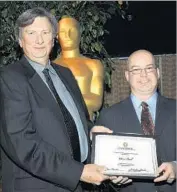  ?? Valerie Macon Getty Images ?? JOHN BAILEY, left, with screenwrit­er Dion Cook, has been elected the president of the film academy.