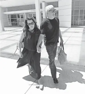  ??  ?? Backpage founder Michael Lacey leaves federal court after being released from custody Friday in Phoenix. MATT YORK/AP