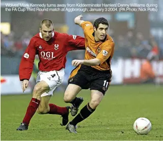  ?? ?? Wolves’ Mark Kennedy turns away from Kiddermins­ter Harriers’ Danny Williams during the FA Cup Third Round match at Aggborough, January 3 2004. (PA Photo: Nick Potts)