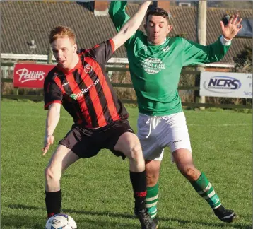  ??  ?? Paul Brennan of Gorey Rangers is tracked by Ricky Fox of Shamrock Rovers.