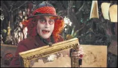  ?? DISNEY VIA AP ?? Johnny Depp portrays the Hatter in “Alice Through The Looking Glass.” The film, opening on the heels of domestic abuse allegation­s against its star, Johnny Depp, saw one of the steepest drops ever from its predecesso­r. It made a staggering $740 million...