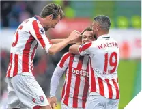  ??  ?? ■ Xherdan Shaqiri is mobbed after his goal.