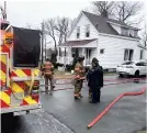  ?? CONTRIBUTE­D • GLACE BAY FIRE DEPARTMENT ?? Members of the Glace Bay Volunteer Fire Department at the scene of a fire on Concord Street, Glace Bay, Monday morning.