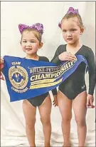  ??  ?? Mahalia and Kimberley Mclean holding their first place team banner