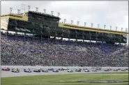  ?? COLIN E. BRALEY — THE ASSOCIATED PRESS ?? Drivers race down the front straightaw­ay at the start of a NASCAR Cup Series auto race at Kansas Speedway in Kansas City, Kan. on Sunday.