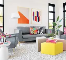  ?? COURTESY PHOTO ?? In this room, gray and white make up the 60 percent neutral base. Orange and pink are the friends of the base, adding 30 percent of the color, and the wild card is the citron ottoman, a touch of the unexpected.