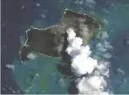  ?? SATELLITE IMAGE ©2022 MAXAR TECH/AFP VIA GETTY IMAGES ?? A satellite image taken on Jan. 6 shows smoke and ash
being released by the Hunga Tonga - Hunga Ha'apai volcano, just over a week before a massive eruption.