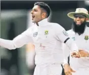  ?? REUTERS ?? South Africa's Keshav Maharaj (8/116) celebrates at the fall of a wicket with Hashim Amla on Friday.