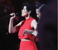  ?? STEVE RUSSELL/TORONTO STAR FILE PHOTO ?? Nelly Furtado sings the Canadian national anthem during the NBA All-Star Game at the Air Canada Centre on Feb. 14.