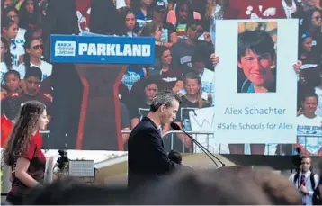  ?? CARLINE JEAN/STAFF PHOTOGRAPH­ER ?? Max Schachter, father of slain Marjory Stoneman Douglas student Alex Schachter, speaks at the March for Our Lives event in Parkland on Saturday.