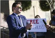  ?? ANJALI SHARIF-PAUL — STAFF PHOTOGRAPH­ER ?? Attorney Nicholas Rosenberg addresses supporters of detainees, regarding his client Edin Enamorado, on Friday outside Victorvill­e Superior Court after a hearing.