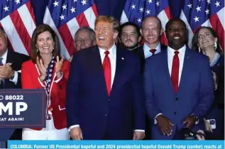  ?? ?? COLUMBIA: Former US Presidenti­al hopeful and 2024 presidenti­al hopeful Donald Trump (center) reacts at an “Election Night Watch Party” in Columbia, South Carolina, on Feb 24, 2024. — AFP