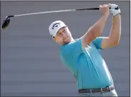  ?? AP/MATT YORK ?? plays his shot from the first tee during the second round of the Tournament of Champions on Friday at Kapalua Plantation Course in Kapalua, Hawaii. Garnett is a rarity on the PGA Tour, coming from a small school such as Missouri Western State of NCAA Division II.