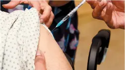  ??  ?? A patient receives a vaccine at Slough's clinic. Ref:133238-14