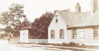  ?? CONTRIBUTE­D • BEATON INSTITUTE, CAPE BRETON UNIVERSITY ?? A.C. Dodd’s residence on the corner of Dorchester Street and the Esplanade in Sydney, known as Judge’s Corner. Two members of the Dodd family stand at the gate. The second building in the picture was used as a ballroom.