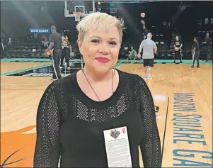  ?? AP PHOTO ?? Holly Rowe stands on the court at Madison Square Garden in New York before a WNBA basketball game between the New York Liberty and the Minnesota Lynx, Thursday, Rowe was back on the sidelines for her first WNBA game of the season Thursday night. It was...