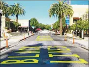  ??  ?? Top left: A Black Lives Matter mural painted on Broadway in Redwood City was later removed by city officials after a request came in to their office to paint “MAGA 2020” on the same street.