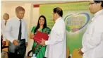  ??  ?? Dinesh de Mel of Unilever Sri Lanka handing over the operating theatre lamp documentat­ion to Health Minister