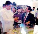  ??  ?? From left: Housing and Constructi­on Minister Sajith Premadasa with Home Lands Md/chairman Nalin Herath