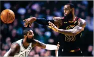  ?? AP PHOTO BY CHARLES KRUPA ?? Cleveland Cavaliers forward Lebron James (23) passes the ball as Boston Celtics guard Kyrie Irving defends during the second quarter of an NBA basketball game in Boston, Wednesday.