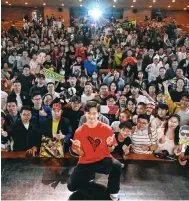  ?? Photo: AFP ?? Zhou Guanyu poses with fans in Shanghai after the world premiere of The First One, a documentar­y on his motor racing career.