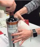  ?? SPACE CARGO UNLIMITED VIA AP ?? In this 2019 photo, researcher­s prepare bottles of French red wine to be flown from Wallops Island, Va., to the Internatio­nal Space Station. On Monday, 12 bottles came back to Earth.