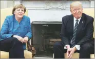  ?? Reuters ?? Donald Trump with Angela Merkel at the White House on Friday. The German leader’s visit is expected to focus on their difference­s over NATO, trade, among other things.